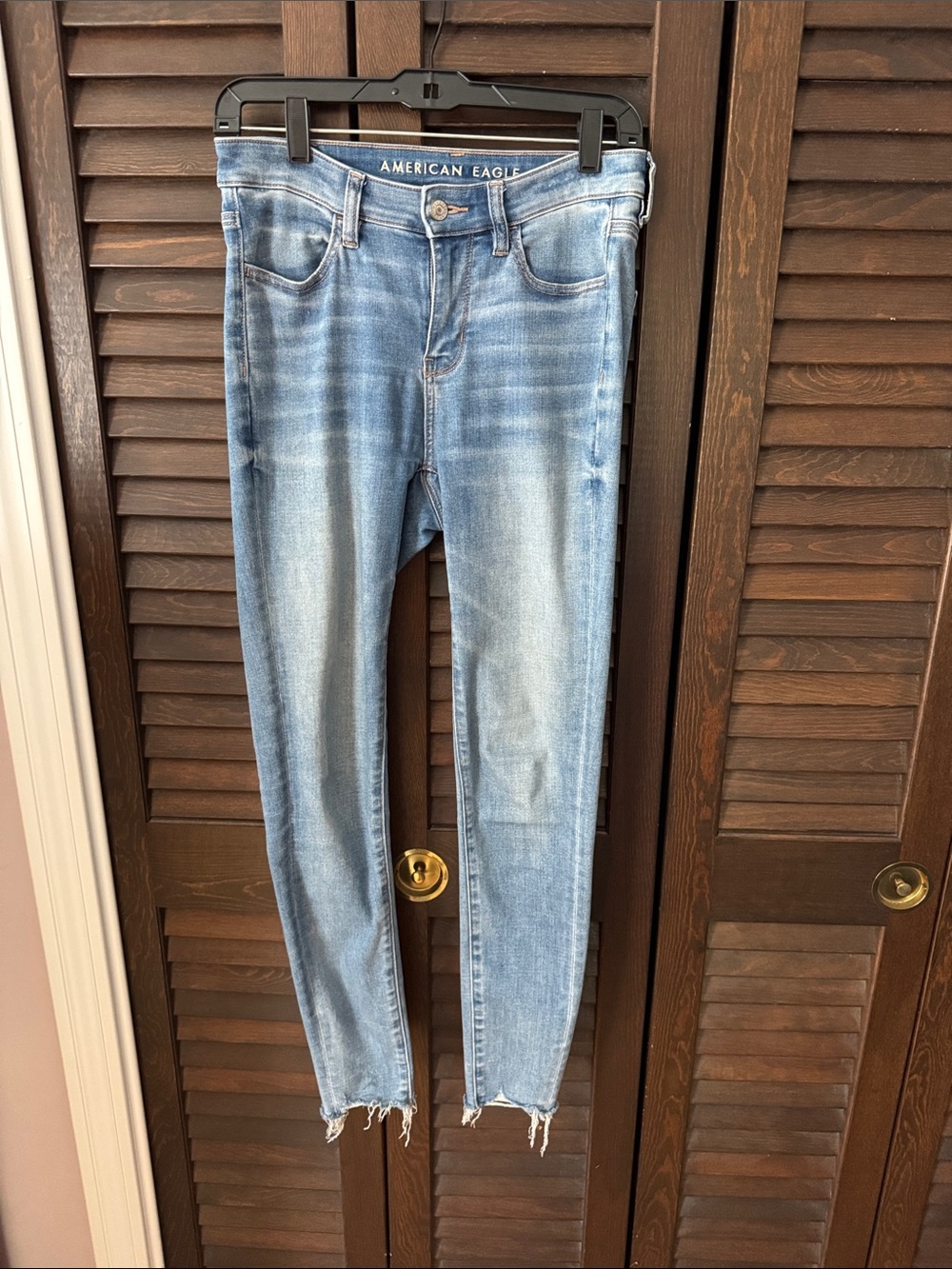 American Eagle Outfitters Faded Light Blue High Rise Jegging with Frayed Hem